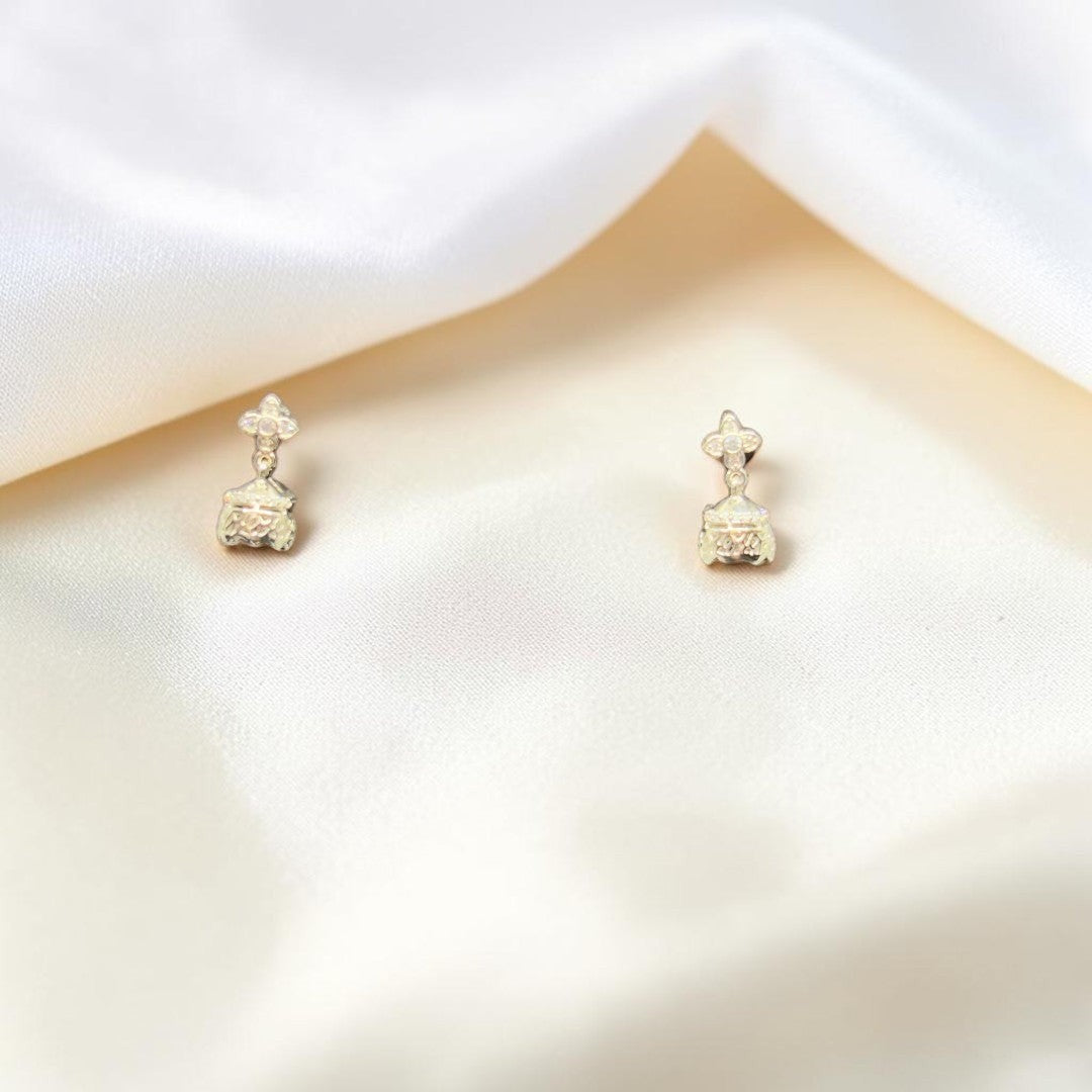 BlingbyAnvika sterling silver jhumka earrings with intricate detailing and cubic zirconia stones.