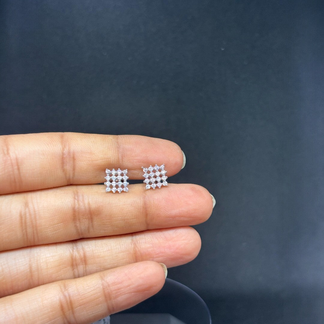 Classic 925 silver stud earrings with sparkling zircon stones for everyday elegance.