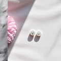 Minimalistic 925 silver earrings offering a clean and timeless design.