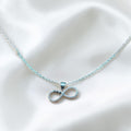 BlingbyAnvika sterling silver infinity necklace with cubic zirconia and heart details. Delicate chain for timeless elegance.