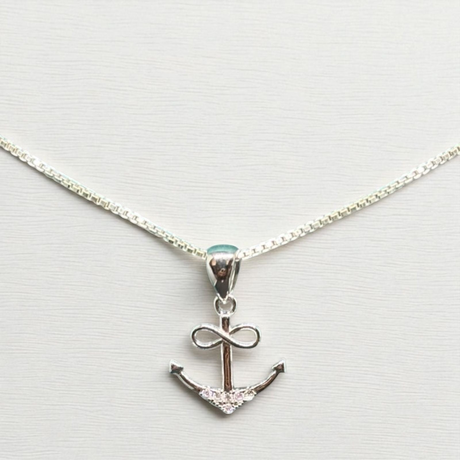 BlingbyAnvika 925 sterling silver anchor pendant with cubic zirconia accents and a delicate chain. Nautical jewelry symbolizing hope and strength.