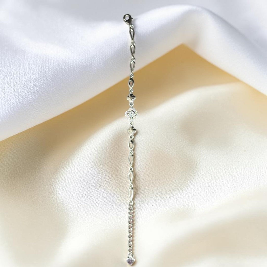 BlingbyAnvika 925 Sterling Silver bracelet with floral charm and cubic zirconia, delicate chain, heart charm.