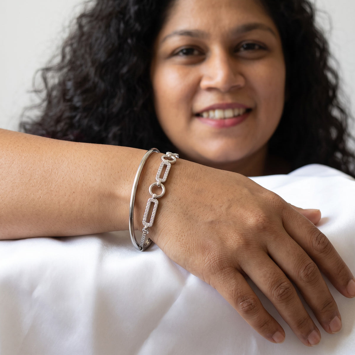 BlingbyAnvika 925 sterling silver flexi kada bracelet with chain link detail worn on a woman's wrist