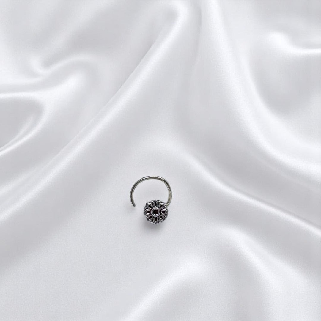 BlingbyAnvika 925 sterling silver nose pin featuring a delicate floral design for a feminine and elegant look.