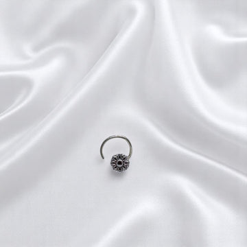 BlingbyAnvika 925 sterling silver nose pin featuring a delicate floral design for a feminine and elegant look.