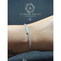 BlingbyAnvika 925 sterling silver geometric cuff bracelet with sparkling stones on a wrist.