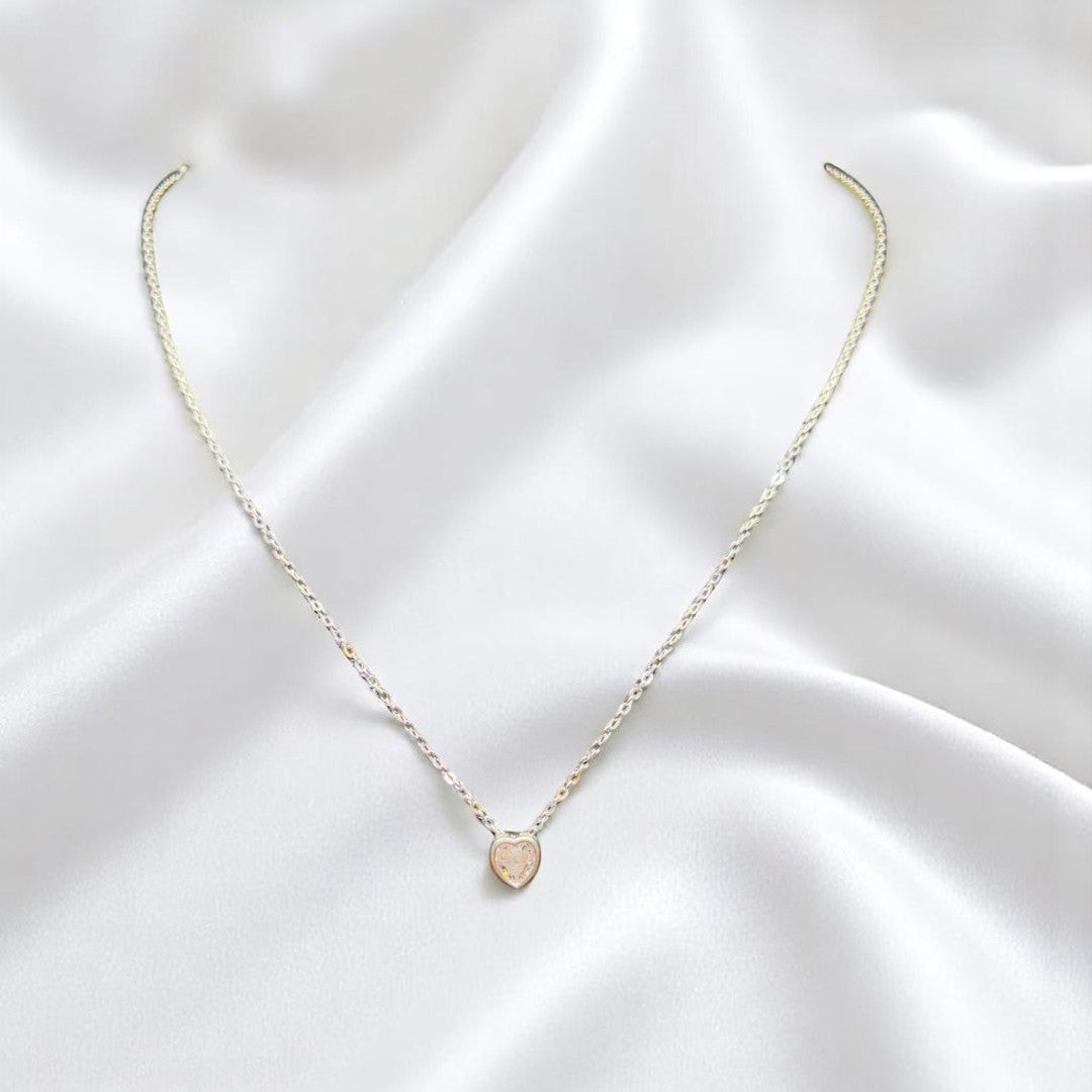 BlingbyAnvika delicate 925 sterling silver heart pendant necklace on a white satin background