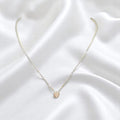 BlingbyAnvika delicate 925 sterling silver heart pendant necklace on a white satin background
