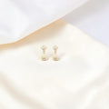 BlingbyAnvika 925 sterling silver jhumka earrings with intricate floral top and bell-shaped base.
