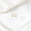 BlingbyAnvika 925 sterling silver jhumka earrings with intricate detailing and a bell-shaped drop.