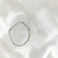 BlingbyAnvika 925 Sterling Silver layered chain bracelet with heart charm and cubic zirconia accent.