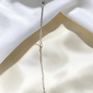 BlingbyAnvika 925 Sterling Silver layered chain bracelet with cubic zirconia accent and heart charm.