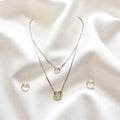 BlingbyAnvika elegant 925 sterling silver necklace and earrings set with double circle pendants adorned with small crystals.