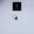 BlingbyAnvika 925 sterling silver nose pin featuring a dainty star design with a textured center on a white background