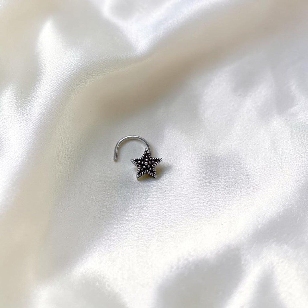 BlingbyAnvika 925 sterling silver nose pin featuring a delicate star design with a textured center