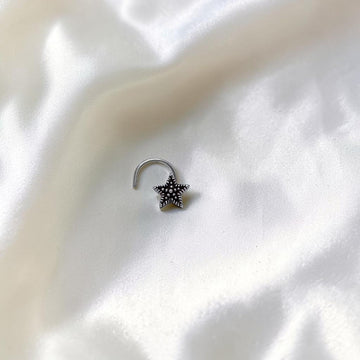 BlingbyAnvika 925 sterling silver nose pin featuring a delicate star design with a textured center