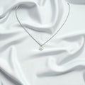 BlingbyAnvika 925 sterling silver necklace with a single clear stone pendant. Delicate chain, minimalist design.