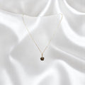 BlingbyAnvika 925 sterling silver necklace with a square-cut black stone pendant and small accent stones.