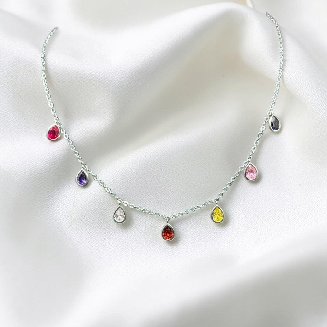 BlingbyAnvika sterling silver necklace with colorful teardrop cubic zirconia gems on a delicate chain.