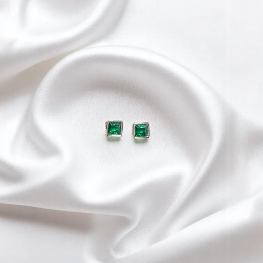 BlingbyAnvika emerald green square cut cubic zirconia stud earrings in polished silver-tone metal.
