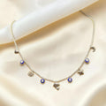 BlingbyAnvika gold-tone short necklace with evil eye, heart, shell, dolphin, star, and moon charms.