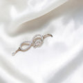 BlingbyAnvika sterling silver bracelet with infinity symbol, cubic zirconia, and 'love' charm.