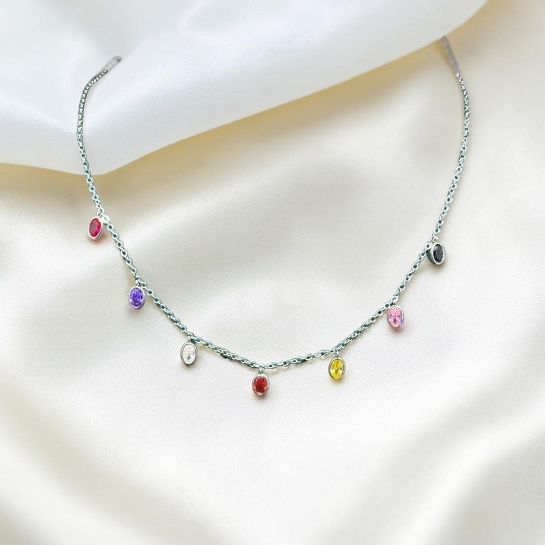 BlingbyAnvika sterling silver necklace with colorful oval gemstones dangling from a fine chain. Perfect for everyday wear.