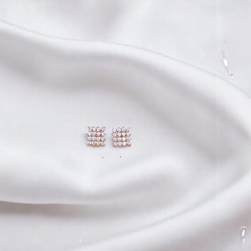 BlingbyAnvika rose gold plated sterling silver square stud earrings with clear zircon stones.