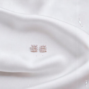 BlingbyAnvika rose gold plated sterling silver square stud earrings with clear zircon stones.
