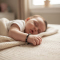 BlingbyAnvika 925 silver baby bracelet with black beads and silver cubes, adjustable pull-string closure.