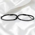 BlingbyAnvika 925 sterling silver bead and black thread Nazarband anklets for protection on white satin fabric