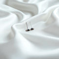BlingbyAnvika 925 sterling silver square stud earrings with black stone accents, elegant and minimalist design.