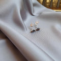 BlingbyAnvika 925 sterling silver square stud earrings with black stones. Timeless, elegant design for versatile wear.