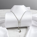 BlingbyAnvika 925 sterling silver ultra-lightweight necklace with two dangling butterfly charms, one with pave crystals.