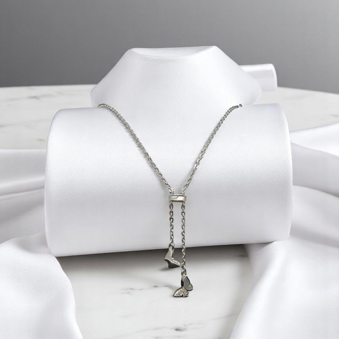 BlingbyAnvika 925 sterling silver ultra-lightweight necklace with two dangling butterfly charms, one with pave crystals.