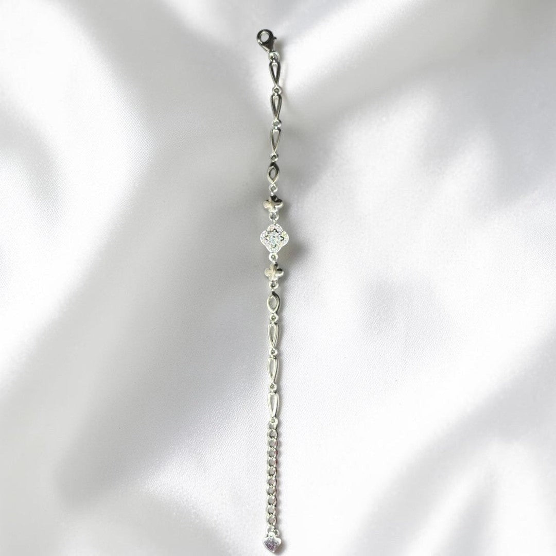 BlingbyAnvika 925 Sterling Silver bracelet with floral charm, cubic zirconia, and heart detail. Delicate chain.
