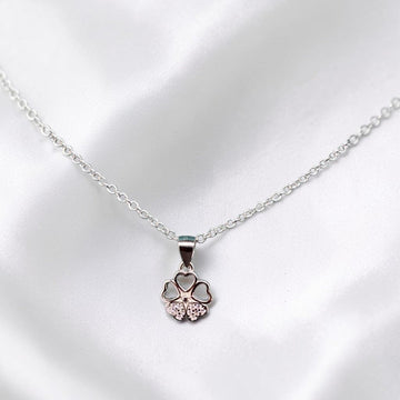 BlingbyAnvika sterling silver necklace with a four-leaf clover pendant featuring heart-shaped petals and cubic zirconia.