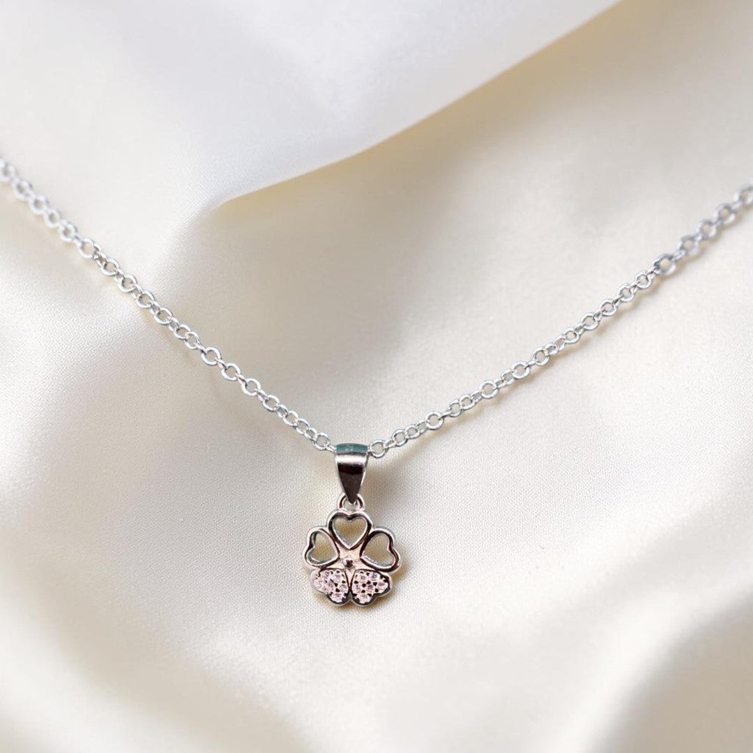 BlingbyAnvika sterling silver necklace with a four-leaf clover pendant featuring heart-shaped petals and cubic zirconia accents.