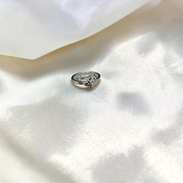 BlingbyAnvika delicate silver-tone ring with a clover motif, adjustable metal band.