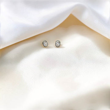 BlingbyAnvika classic 925 sterling silver stud earrings with sparkling cubic zirconia and screw-back closure.