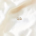 BlingbyAnvika classic sterling silver stud earrings with cubic zirconia stones, perfect for everyday wear.