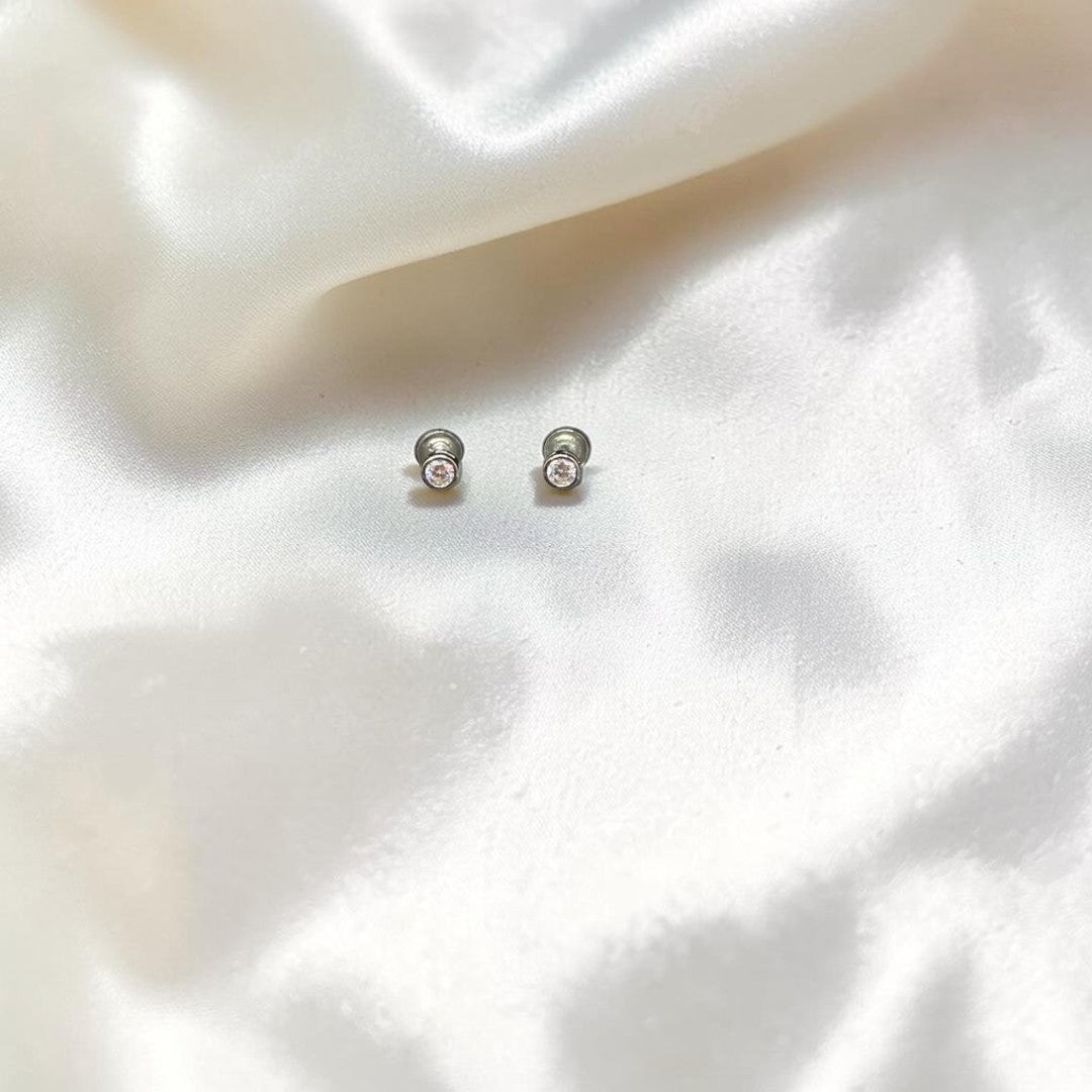 BlingbyAnvika sterling silver stud earrings with cubic zirconia and screw backs.