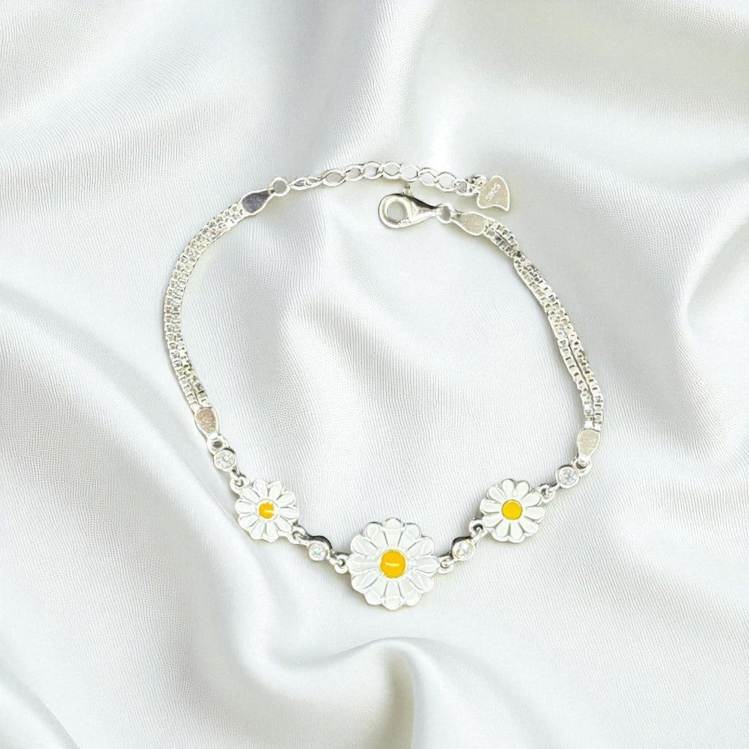 BlingbyAnvika 925 silver daisy charm bracelet with white and yellow enamel flowers and clear crystal accents.