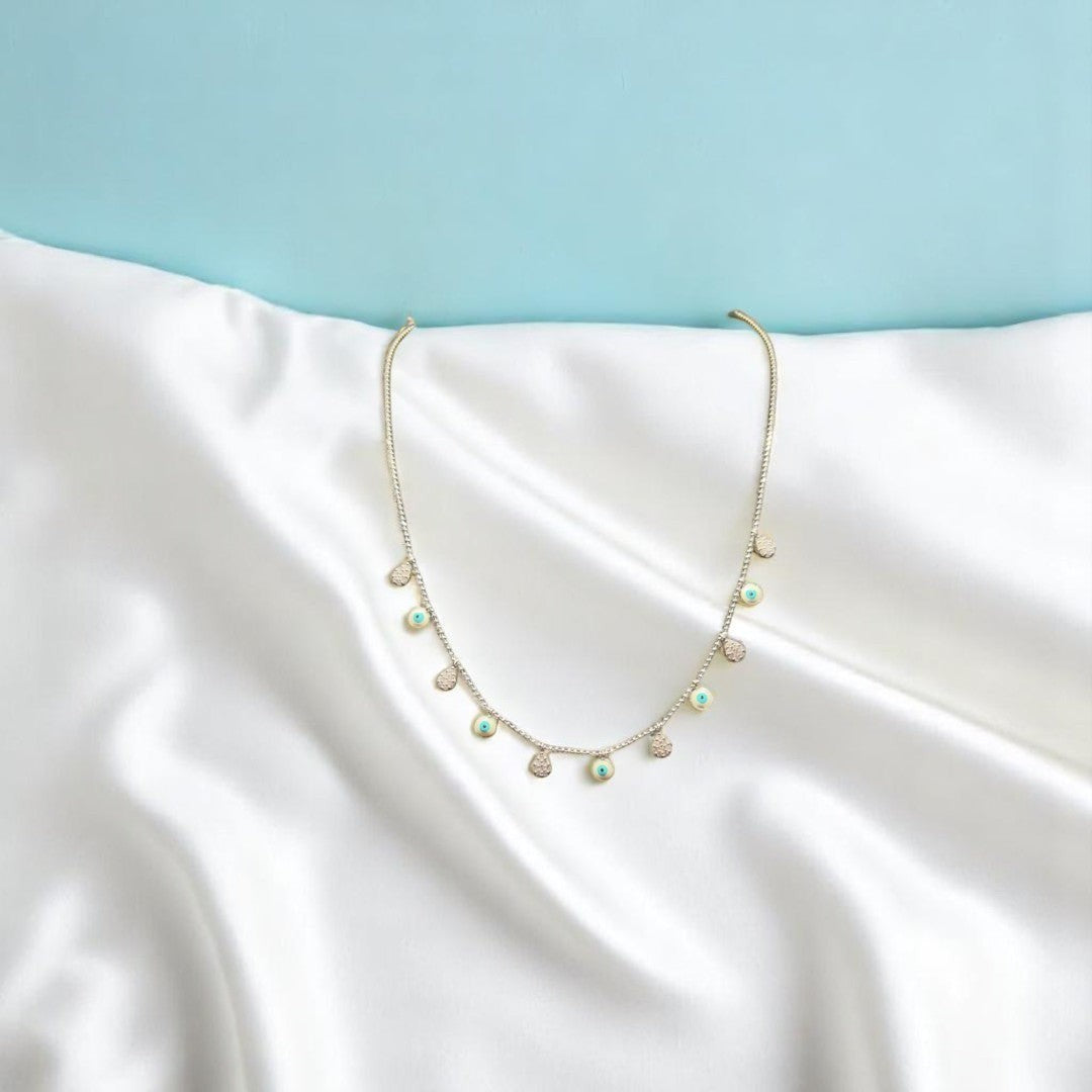 BlingbyAnvika sterling silver short necklace with dangling evil eye charms and small crystal accents.