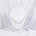 BlingbyAnvika sterling silver short necklace with dangling evil eye and horseshoe charms.
