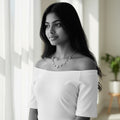 BlingbyAnvika sterling silver short necklace with evil eye charms, worn by a model.