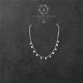 BlingbyAnvika sterling silver short necklace with dangling evil eye and crystal charms.