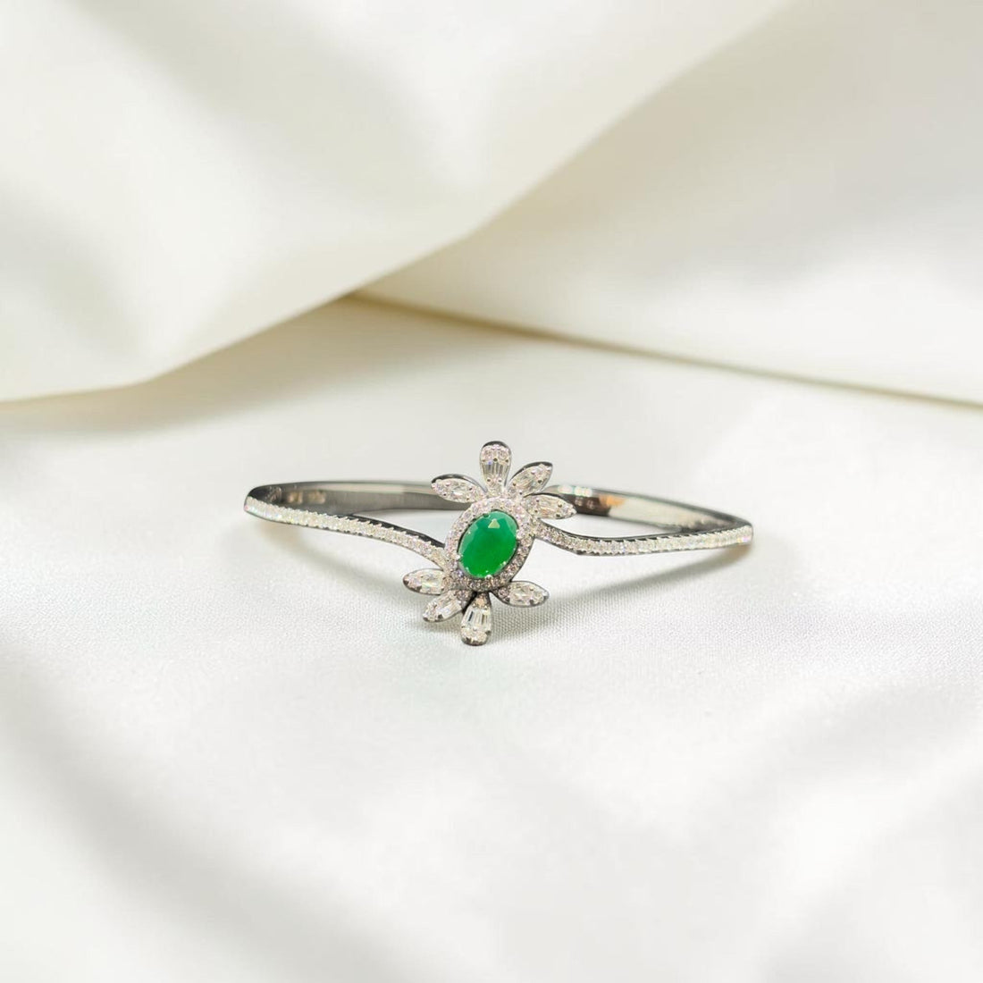 BlingbyAnvika 925 sterling silver floral bangle bracelet with green gemstone and cubic zirconia accents.