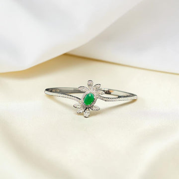 BlingbyAnvika 925 silver floral bracelet featuring a central oval green stone and marquise-cut white crystal petals.