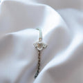 BlingbyAnvika 925 silver bracelet with heart and butterfly charms, adorned with cubic zirconia stones.